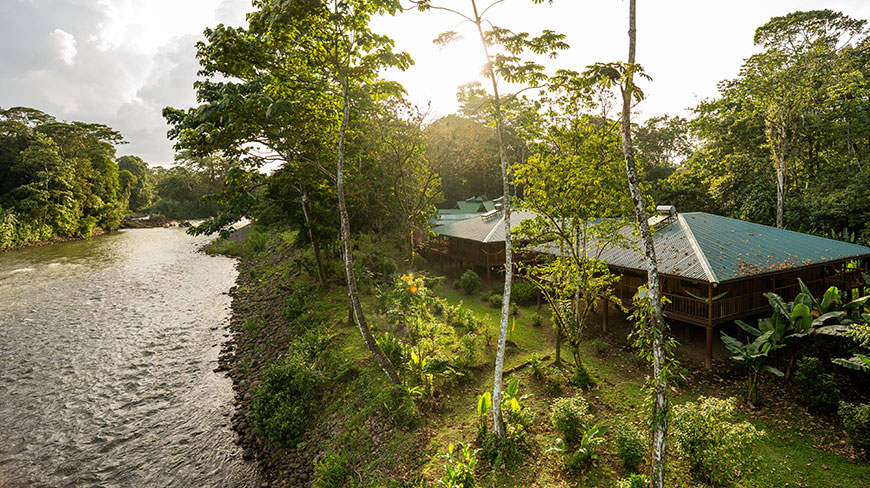 An aerial view of the Selva Verde Lodge next to the Sarapiqui River, surrounded by the lush green jungle of Costa Rica.